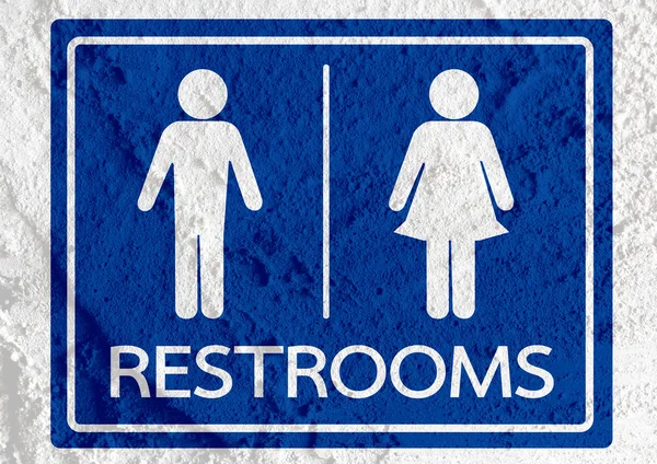 Toiletter ikon og piktogram mand kvinde tegn på cementvæg tekstur - Stock-foto