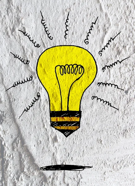 Idée Icône ampoule sur le mur de ciment texture fond design — Photo