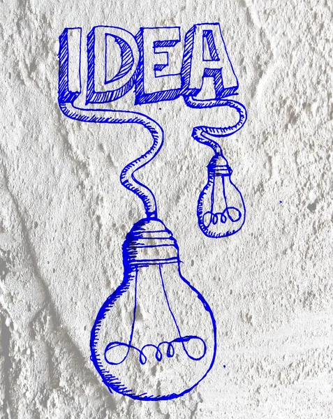 Idea Icono de bombilla en pared de cemento textura fondo diseño — Foto de Stock