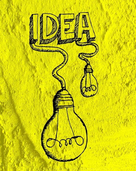 Idea Icono de bombilla en pared de cemento textura fondo diseño — Foto de Stock