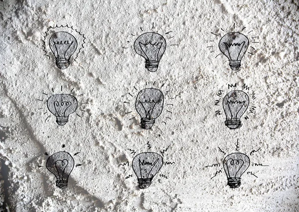 Idée Icône ampoule sur la texture du mur fond design — Photo