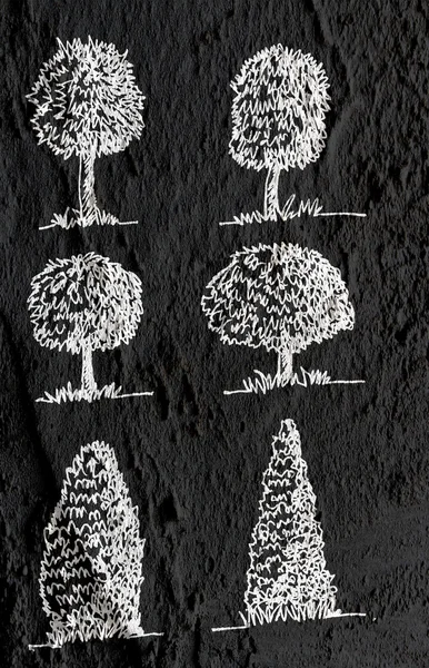 Arbres avec des feuilles en silhouettes sur fond de texture murale d — Photo