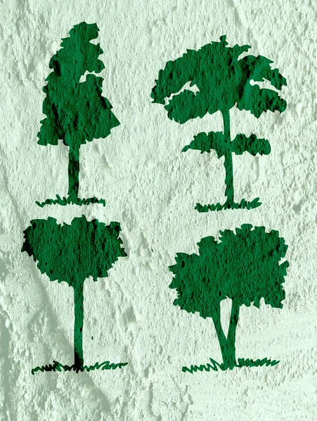 Bäume mit Blättern in Silhouetten auf Wandtextur Hintergrund d — Stockfoto