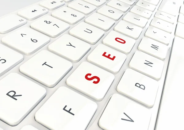 SEO kavramı - beyaz parlak klavyede yazılmış kelime — Stok fotoğraf