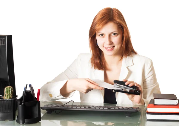 Girl holds a paper stapler — Stock Photo, Image