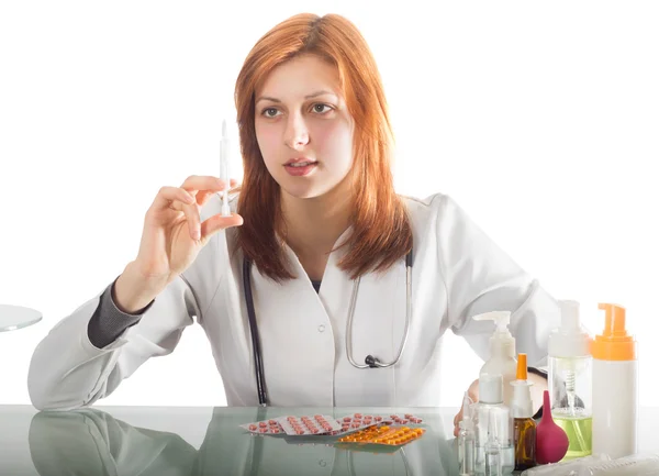 Woman doctor holding a syringe — Stock Photo, Image