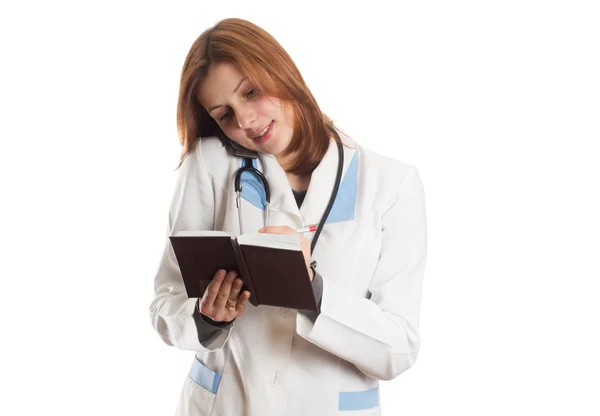 Medico femminile offre un arancione — Foto Stock