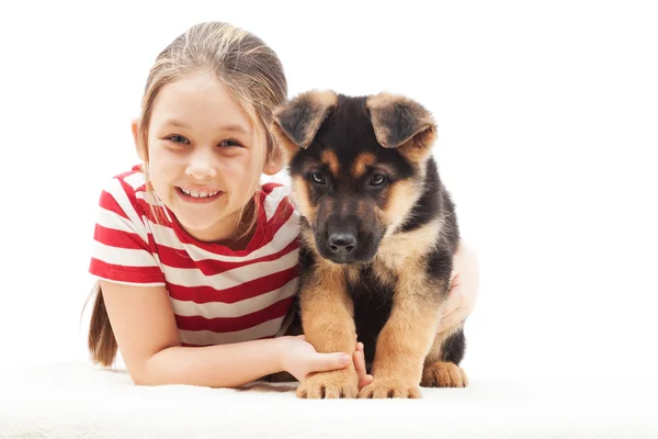 Little girl and puppy shepherd dog — Stock Photo, Image