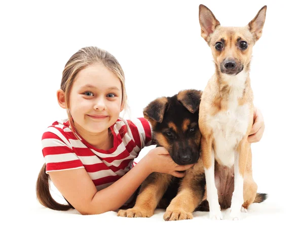 Little girl and her four-legged friends — Stock Photo, Image