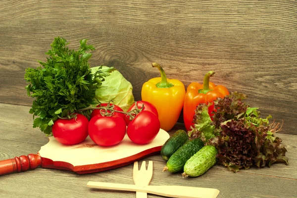 Vegetables on wooden board — Stock Photo, Image