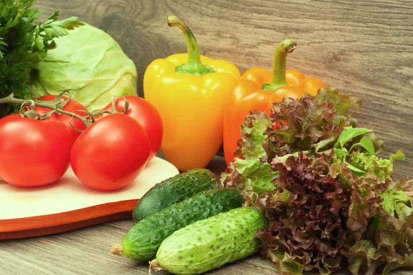 Mixed vegetables on a wooden background — Stock Photo, Image