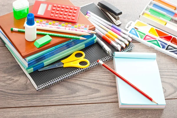 Accessories from school on a wooden table — Stock Photo, Image