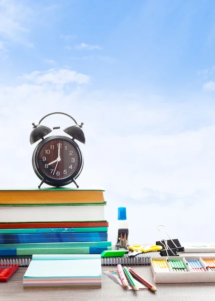 School Supplies on background blue sky with clouds — Stock Photo, Image