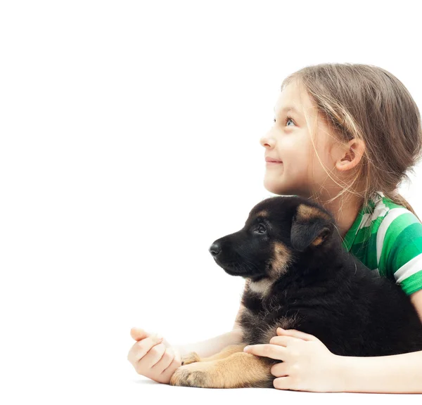 Girl and puppy looking up — Stock Photo, Image