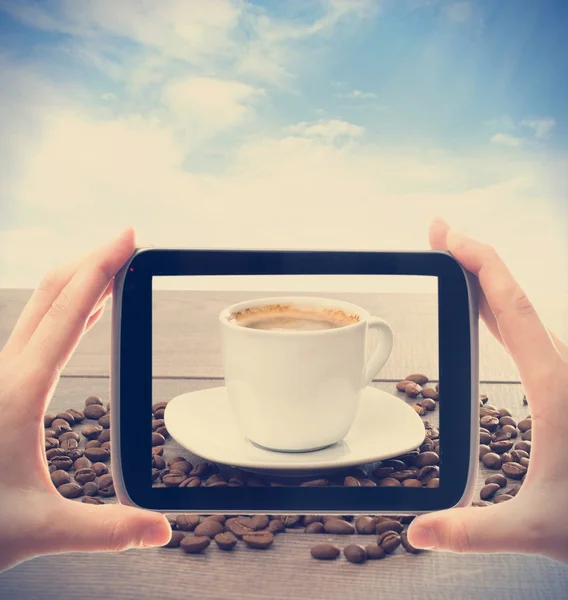 Photographing smartphone cup of coffee — Stock Photo, Image