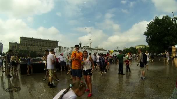 A crowd of people drenched in water — Stock Video