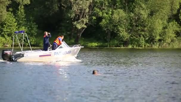 The boat with the rescuers floating on a river — Stock Video