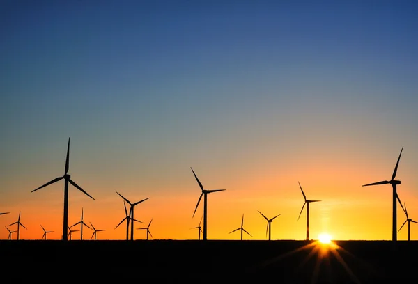 Wind turbines at sunset Stock Photo