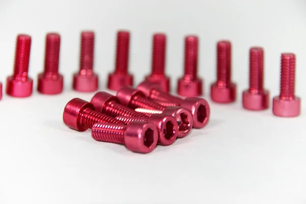 Zócalo / tornillo hexágono anodizado rojo — Foto de Stock