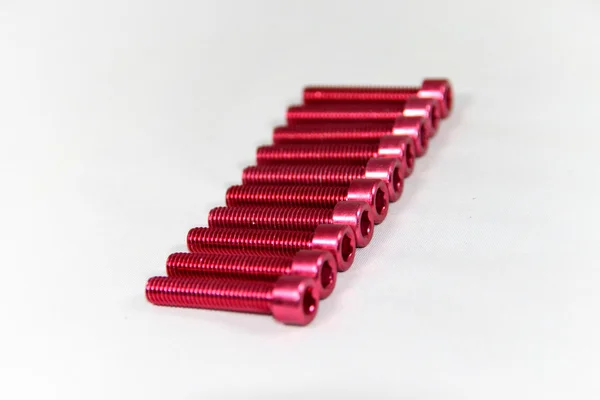 Zócalo / tornillo hexágono anodizado rojo — Foto de Stock