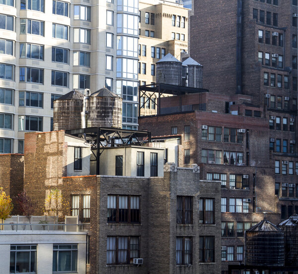 Building with water tower on their roof in New York City