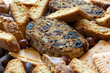 A group of different biscuits and cupcake