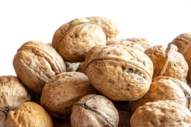 Group of whole solid walnuts background