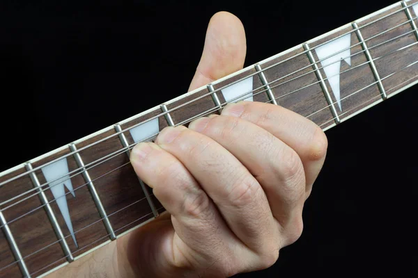 Guitarists Hand Playing Fretboard Electric Guitar - Stock-foto