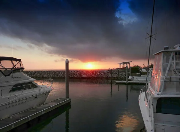 Boats and yachts docked at a marina in downtown Pensacola, Florida