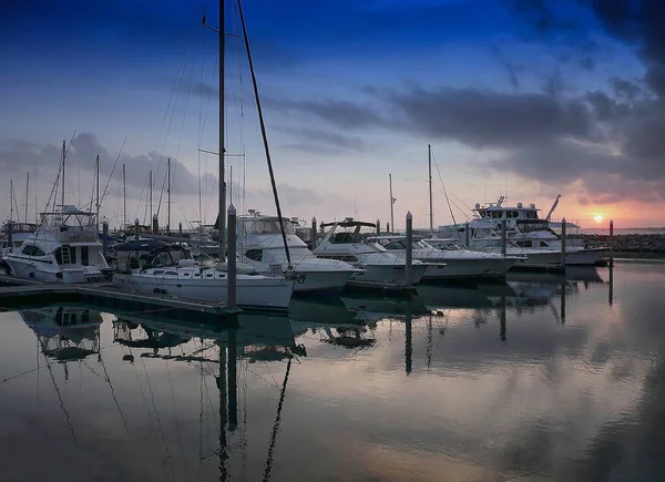 Boats and yachts docked at a marina in downtown Pensacola, Florida