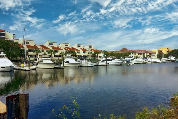 Boats and yachts docked at a marina in downtown Pensacola, Florida