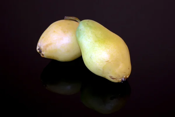 Scene with two pears fruits isolated on black background — Stock Photo, Image