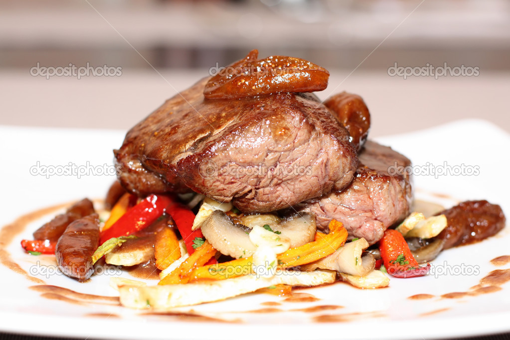 Beef steak with grilled vegetable and mushrooms