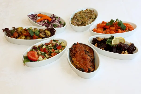 Fresh salads on restaurant table — Stock Photo, Image