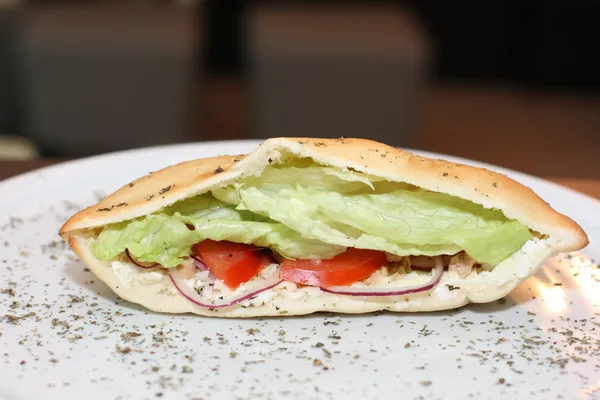 Sandwich with tuna fish, salad and tomatoes — Stock Photo, Image