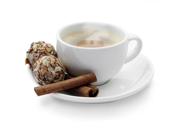 Cup of coffee with chocolates and cinnamon — Stock Photo, Image