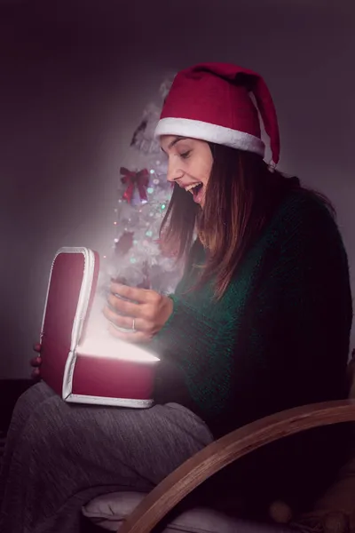 Girl Santa Claus Hat Opens Box Christmas Present — Stock Photo, Image