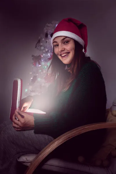 Girl Santa Claus Hat Opens Box Christmas Present — Stock Photo, Image