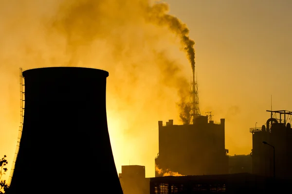 Fertilizer mill polluting the atmosphere with smoke and smog Stock Photo