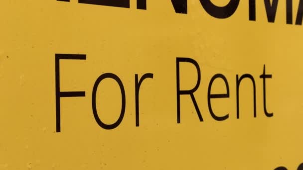 Yellow For Rent sign on closed restaurants window — Stock Video