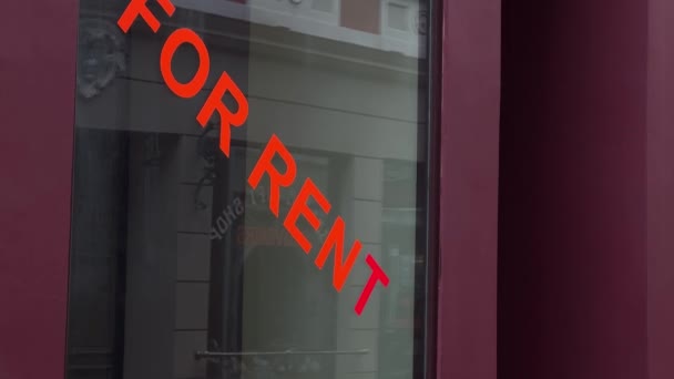 Red For Rent sign on closed restaurants window — Stock Video