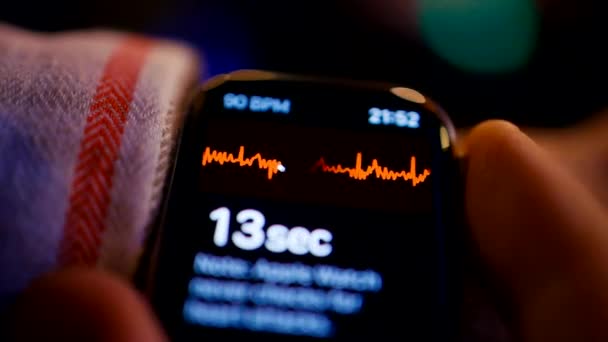 Man trying to measure ECG or Heart Rate at bar using smart watch — Stock Video