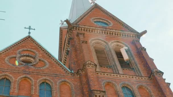 5G telecomuinication transmitter is installed at a brick church wall — Stok video