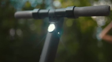 Focus rack: From Electric scooter handle to a beautiful woman ready to start a ride with beautiful bokeh