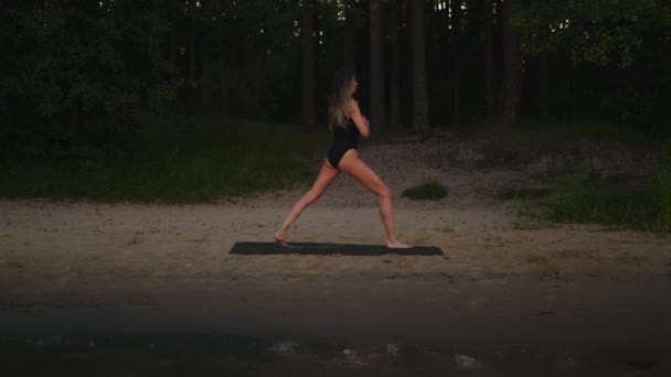 Young Woman Practices Yoga Sandy Beach Using Mat Evening — Wideo stockowe