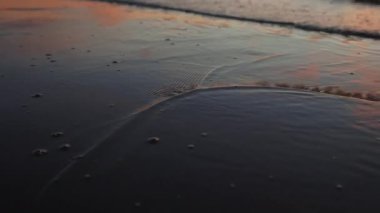 Emotion panning from waves over amazing sunset at sea slow motion