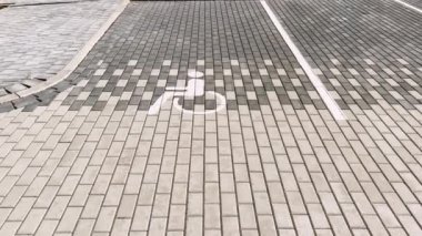 FAST Establishing shot of a disabled sign on pavement at mall real time