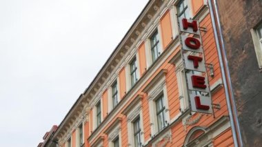 Beautiful building with a large HOTEL sign mounted onto its facade real time