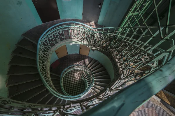 Grunge, green spiral staircase — Stock Photo, Image