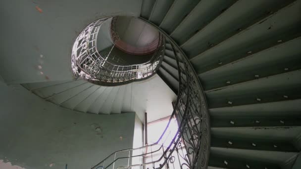 Spiral old and grunge staircase in green color, abstract point of view — Stock Video